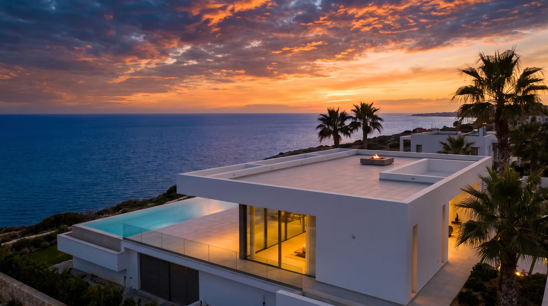 Modern Cyprus villa roof terrace overlooking the Mediterranean at dusk